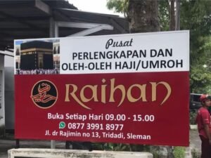 Papan Nama Toko Perlengkapan Haji dan Umroh
